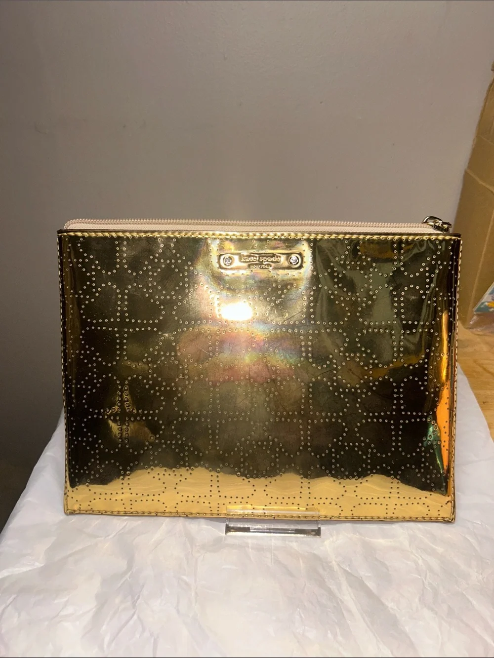 Kate Spade New York metallic gold pouch featuring a perforated spade pattern EUC